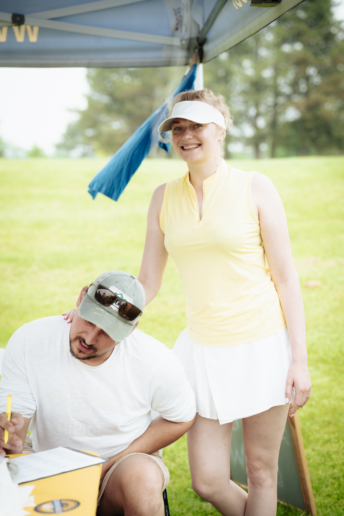 Golfers teeing off at the UYA tournament